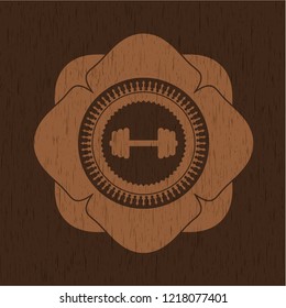 big dumbbell icon inside wood badge or emblem