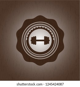 big dumbbell icon inside wood emblem