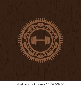 big dumbbell icon inside wooden emblem. Retro