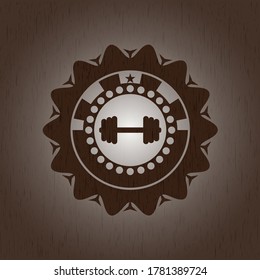 big dumbbell icon inside wooden emblem. Vintage. 