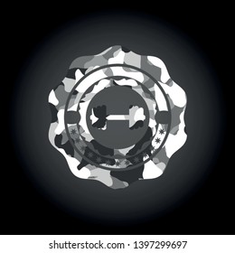 big dumbbell icon on grey camouflage texture