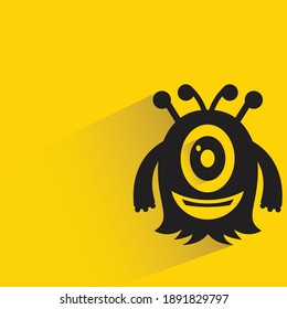 big eye monster with shadow on yellow background vector