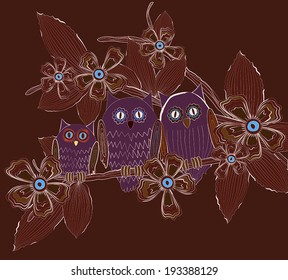 Big eyed owls family sitting on tree brunch at night 