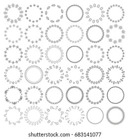 Big hand drawn collection of different Christmas round wreaths isolated on white background.