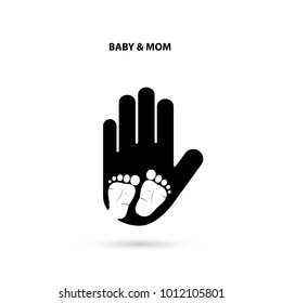 Big hand and small feet icon.Idea of the sign for the association of care.Feet in hand concept.Baby feet and Mom hand.Vector illustration 

