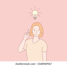 Big idea concept with man and light bulb. Idea symbol with businessman pointing to a light bulb.