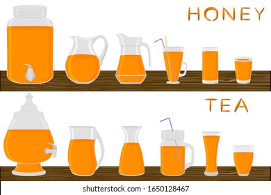 Big kit different types pitcher, honey tea in jugs various size. Pitcher consisting of organic plastic jugs for fluid honey tea. Jugs of bright honey tea it pitcher standing on wooden kitchen table.