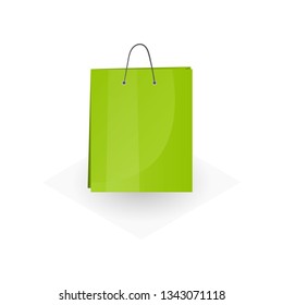 Big lime green paper or cardboard shopping or gifts bag isolated on white background