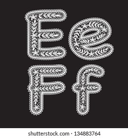 Big and lowercase letters E and F are written in white lace. Lace font for the inscriptions.