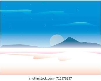 big moon in haze behind the mountains