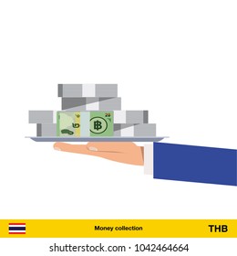 Big pile of money on the tray. Winning the jackpot.  Thai baht banknote.