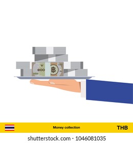 Big pile of money on the tray. Winning the jackpot. Thai baht banknote.
	
