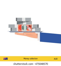 Big pile of money on the tray. Winning the jackpot. Australian Dollar banknote.