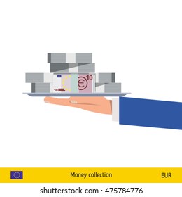 Big pile of money on the tray. Winning the jackpot. Euro banknote.