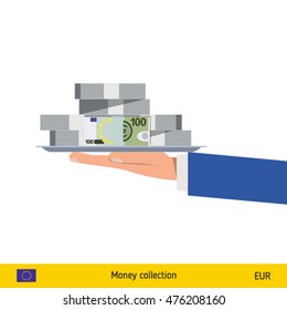 Big pile of money on the tray. Winning the jackpot. Euro banknote.
