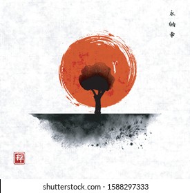 Big red sun and green tree in field. Traditional oriental ink painting sumi-e, u-sin, go-hua on rice paper background. Hieroglyphs - eternity, freedom, happiness, zen.
