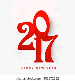 Big red text 2017 on snowflakes decorated background. Elegant greeting card design for Happy New Year celebration.