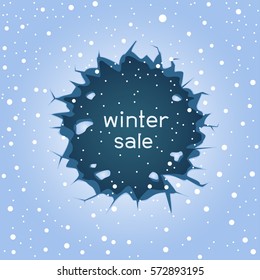 Big round blue ice hole crack and falling large snow. Text winter sale lettering