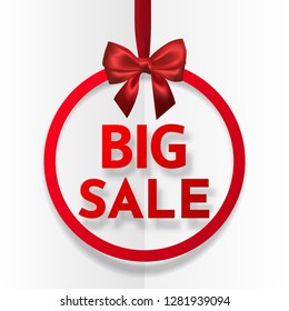 Big sale. Bright holiday round frame banner hanging with red ribbon and silky bow on white background. Vector illustration.