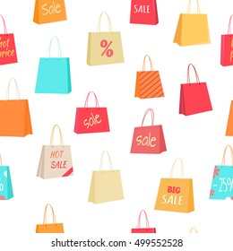 Big sale and discounts seamless pattern. Colorful paper shopping bags with text on white background flat vector illustration. For goods wrapping paper, labels, advertising printing materials design