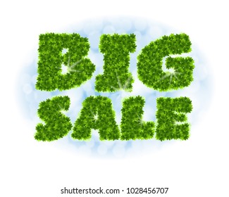 Big sale. Letters from maple leaves on a heavenly background with the effect of bokeh and sunlight.