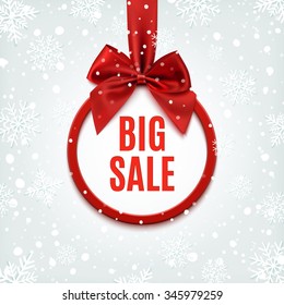 Big sale, round banner with red ribbon and bow, on winter background with snow and snowflakes. Vector illustration.