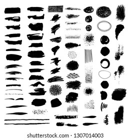 Big set. Black brush strokes, spots, strokes, hatching on a white background.