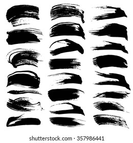 Big set of black textured abstract strokes isolated on a white background