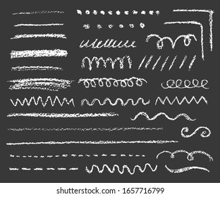 big set of chalk lines and strokes on dark background, variation of shapes and length