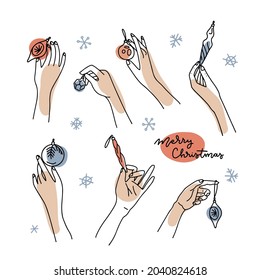 Big set of female hands holding Christmas balls and baubles. Hand drawn vector illustration in line art style isolated on a white background with abstract shapes.