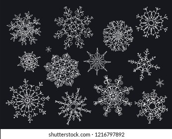 Big set of hand drawn doodle style snowflakes isolated on black background. Vector illustration.
