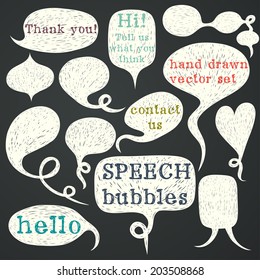 Big set of hand drawn speech bubbles on chalkboard background. Doodle cartoon comic bubbles.
