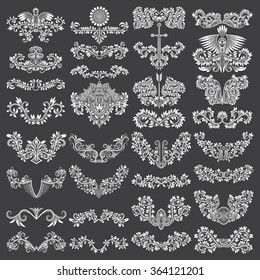 Big set of ornamental elements for design. White floral decorations on black. Isolated tattoo patterns in vintage style. Vintage page ornate decorations.