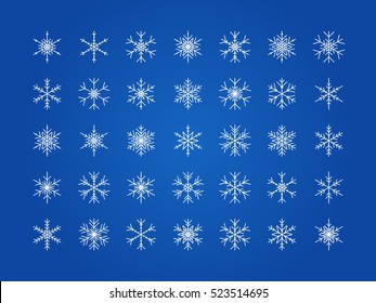 Big set of vector contour white snowflakes on a blue background for design New Year and Christmas.