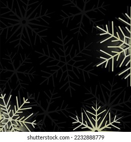 Big shiny snowflakes in gold on dark black background with copy space for your text