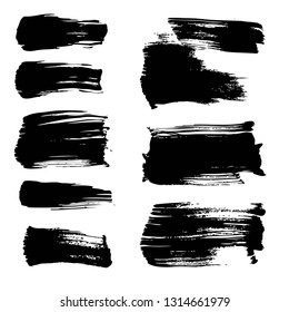 Big strokes of black thick paint isolated on white background