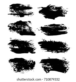 Big textured brush strokes different shapes isolated on a white background