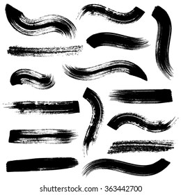 Gran colección de trazos de pincel negro vectorial en blanco