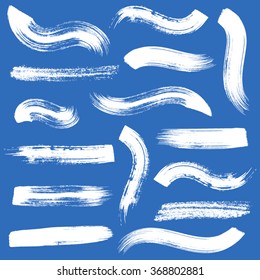 Big vector white brush strokes collection on blue