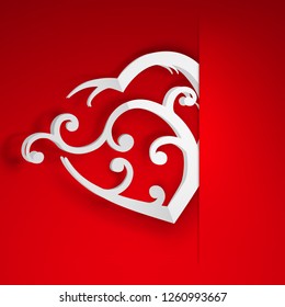 Big white heart with curls inserted into a cutout in a sheet of red paper