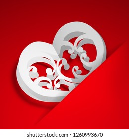 Big white heart with curls inserted into a cutout in a sheet of red paper