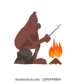 Bigfoot sitting on stone near campfire and roasting marshmallow, mythical creature cartoon character vector Illustration on a white background