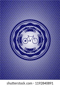 bike icon inside badge with denim background