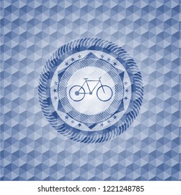 bike icon inside blue emblem or badge with geometric pattern background.