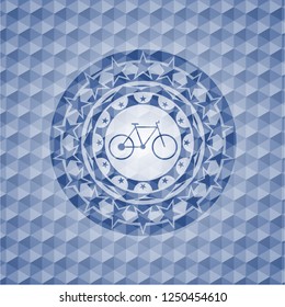 bike icon inside blue emblem with geometric pattern.