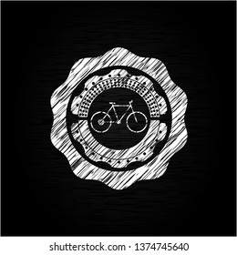 bike icon inside chalk emblem written on a blackboard