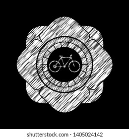 bike icon inside chalk emblem written on a blackboard