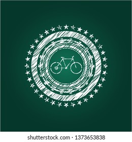 bike icon inside chalkboard emblem written on a blackboard