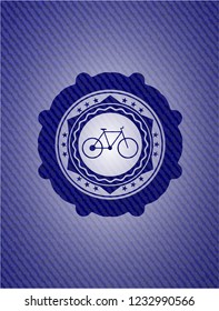 bike icon inside emblem with denim high quality background
