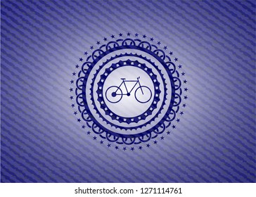 bike icon inside emblem with denim high quality background